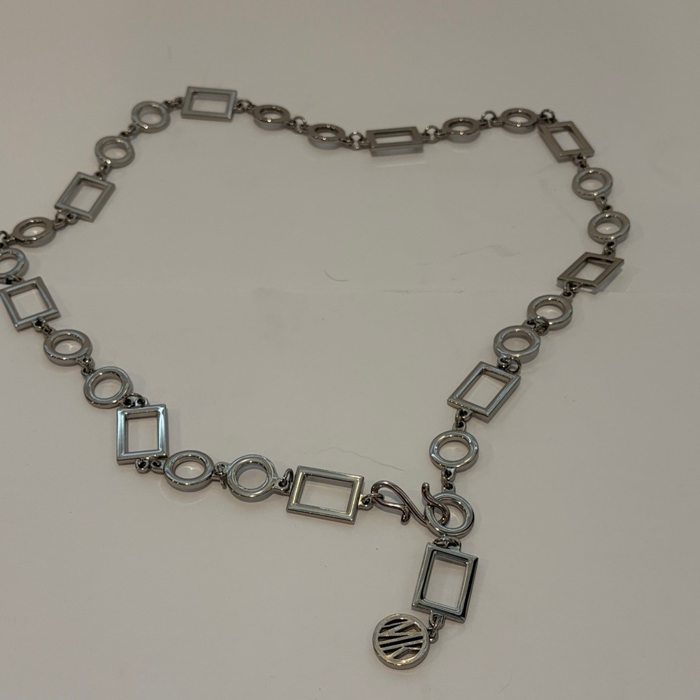 Michael Kors Elegant Silver Geometric belt. Size is adjustable